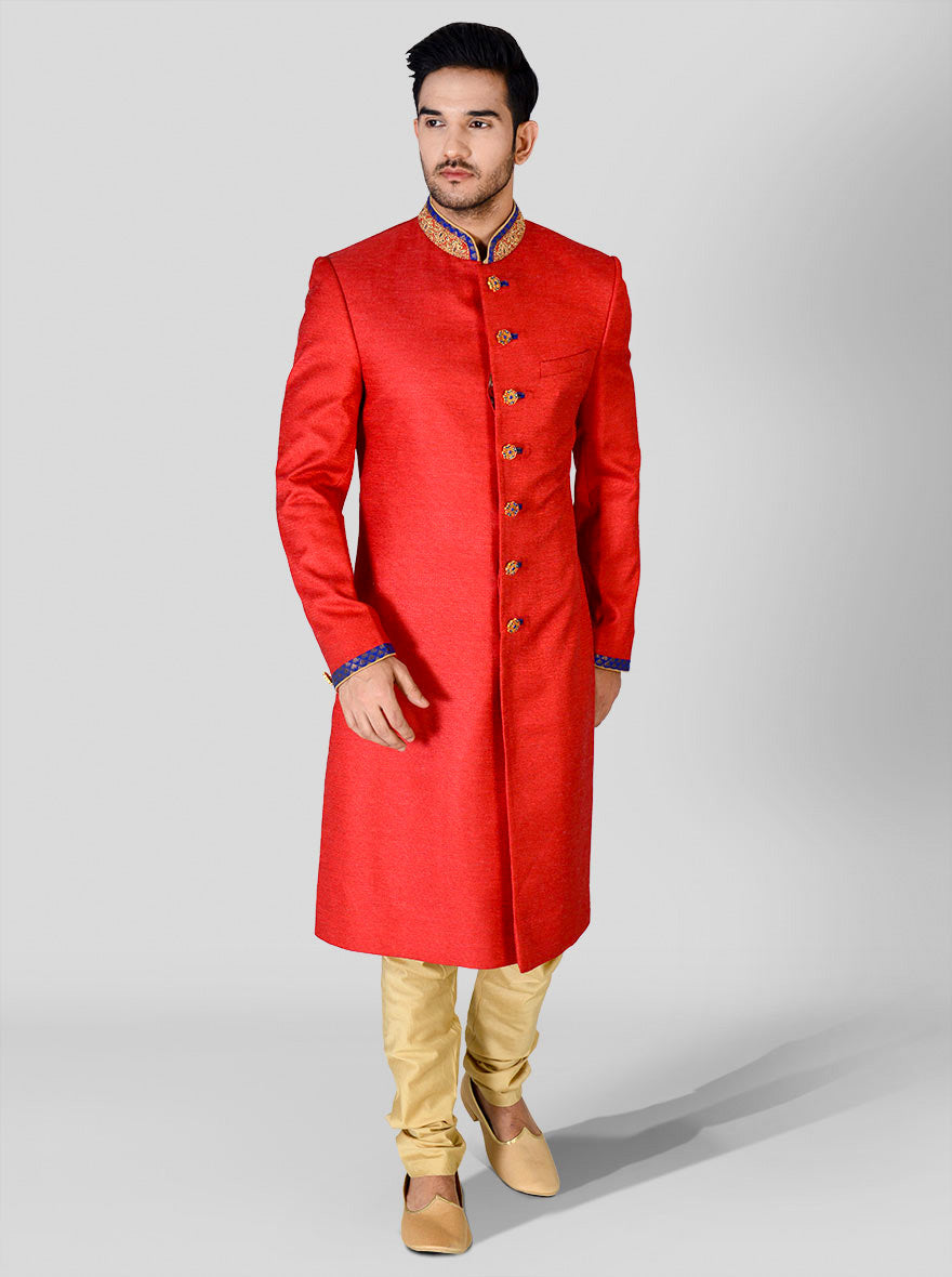 Vibrant red sherwani for grooms, combining comfort and style for the big day.