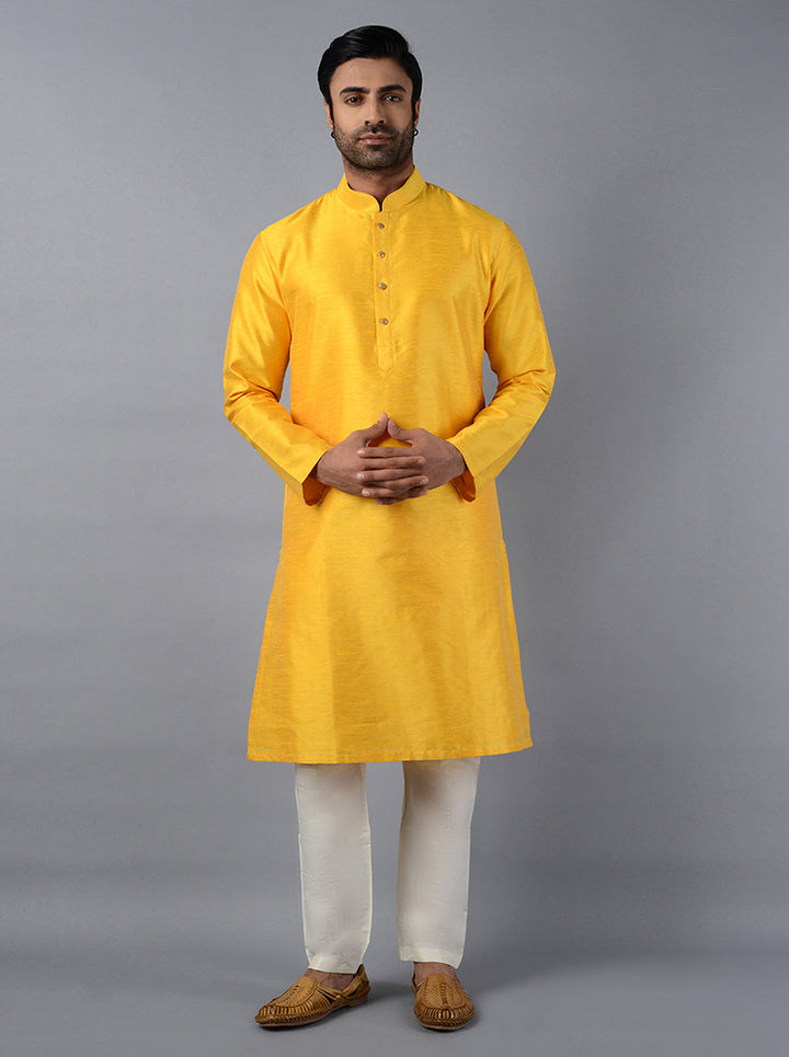 Make a bold statement with our stylish sunny yellow kurta set for festive occasions.