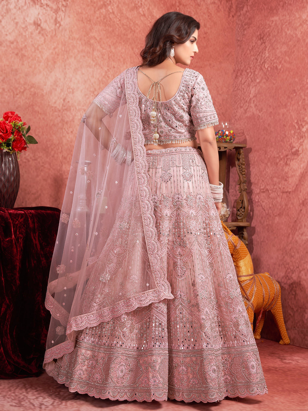 Attractive Pink Mirror Work Net Bridal Lehenga Choli With Dupatta