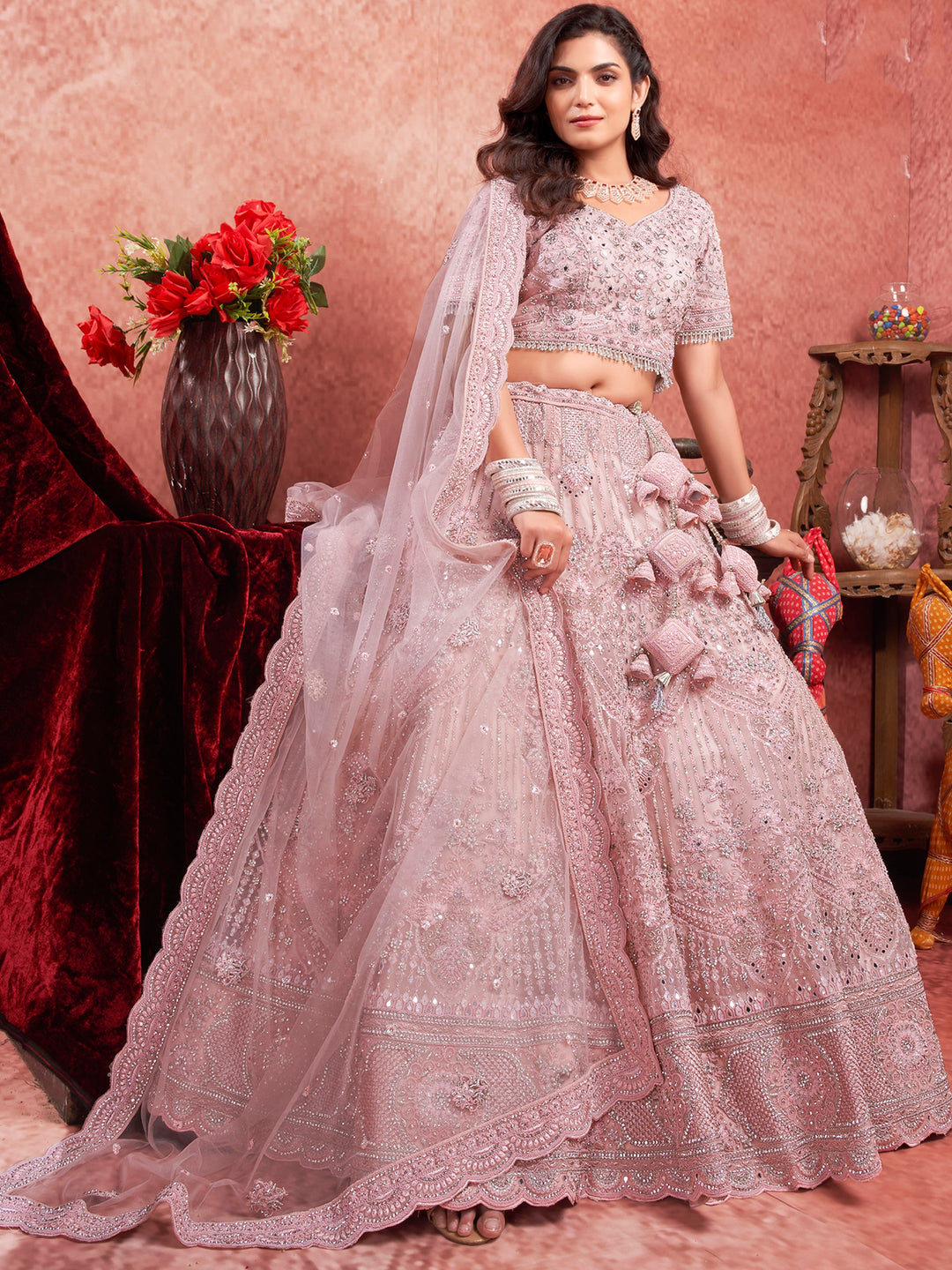 Attractive Pink Mirror Work Net Bridal Lehenga Choli With Dupatta