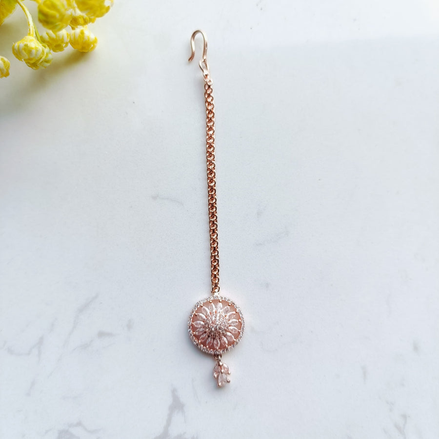 Gorgeous rose gold mang tika, a stylish accessory for festive occasions.