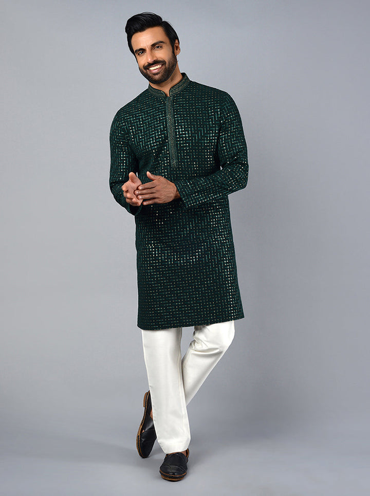 Celebrate in style with this stunning dark green kurta set, tailored for modern men.