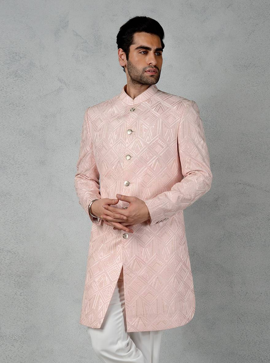 Stylish pink Indo-Western kurta for men, featuring intricate embroidery and full sleeves for a modern ethnic look.