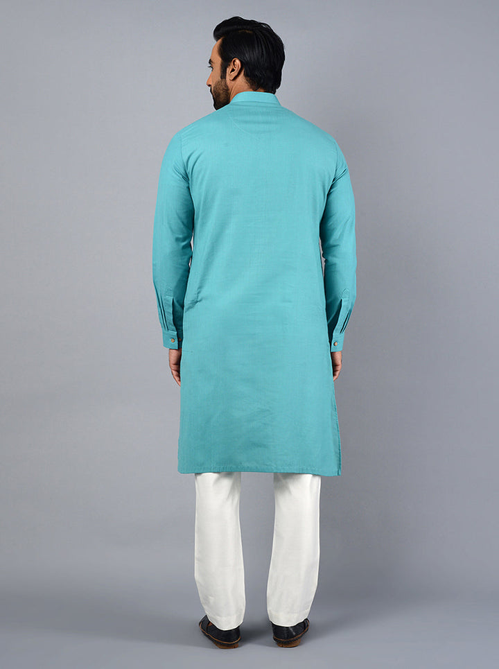 Experience luxury and comfort with this beautifully crafted sea blue kurta set for special occasions.