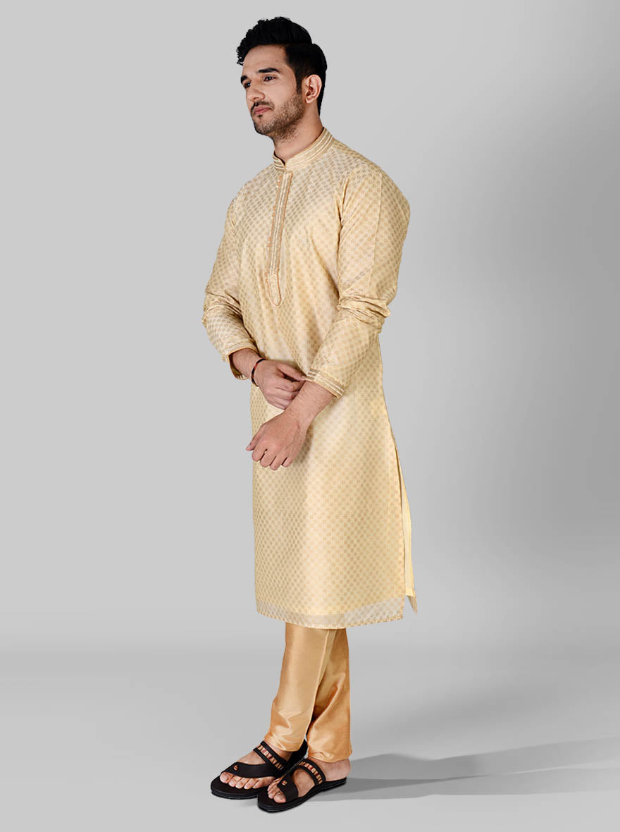 Celebrate in style with our luxurious beige and light golden kurta pajama set for men.