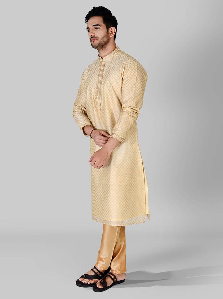 Celebrate in style with our luxurious beige and light golden kurta pajama set for men.