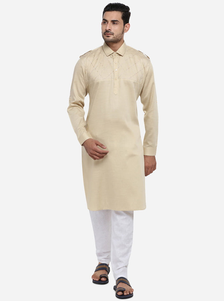 Elevate your ethnic wardrobe with this stylish beige pathani set.