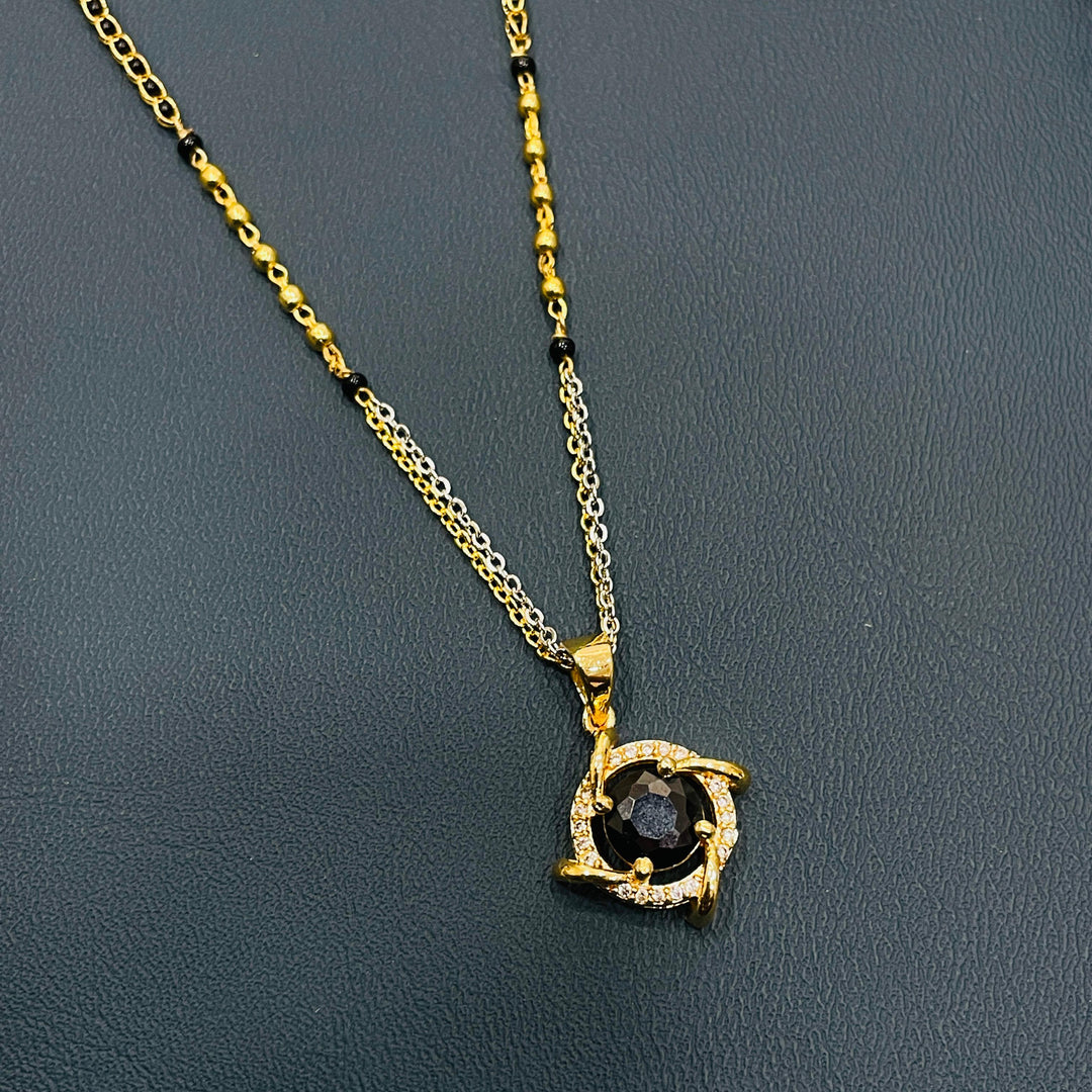 Gold-plated black beaded mangalsutra necklace, alloy material for a traditional touch.