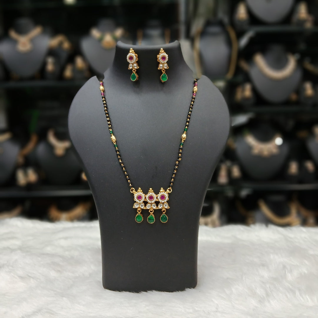 Stylish black beaded mangalsutra necklace, gold-plated alloy, traditional design.