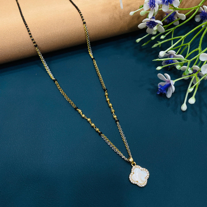 Black beaded mangalsutra in gold-plated alloy, traditional design for a classic and stylish look.