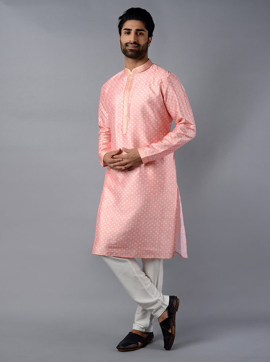 Celebrate in style with our beautifully crafted peach kurta set, tailored for modern men.