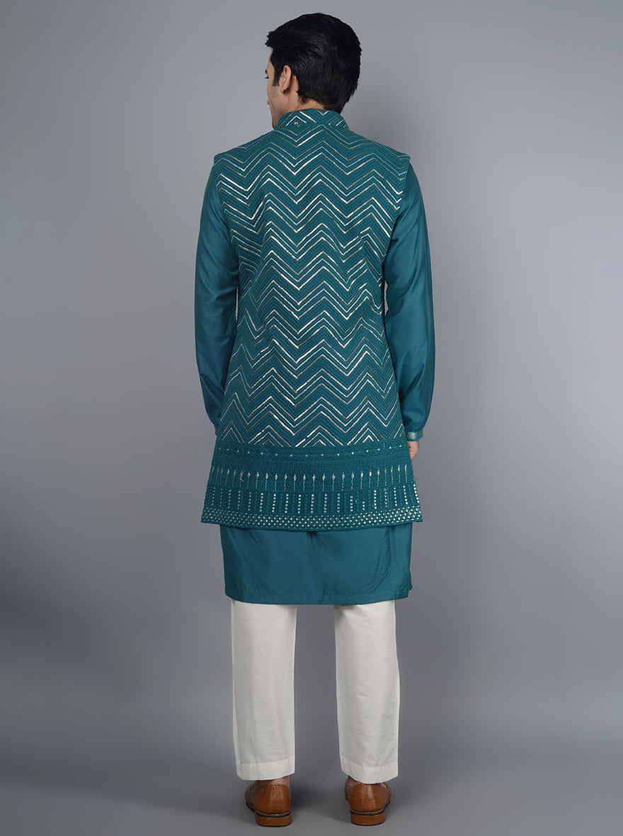 Make a sophisticated statement with this deep blue kurta set for celebrations.