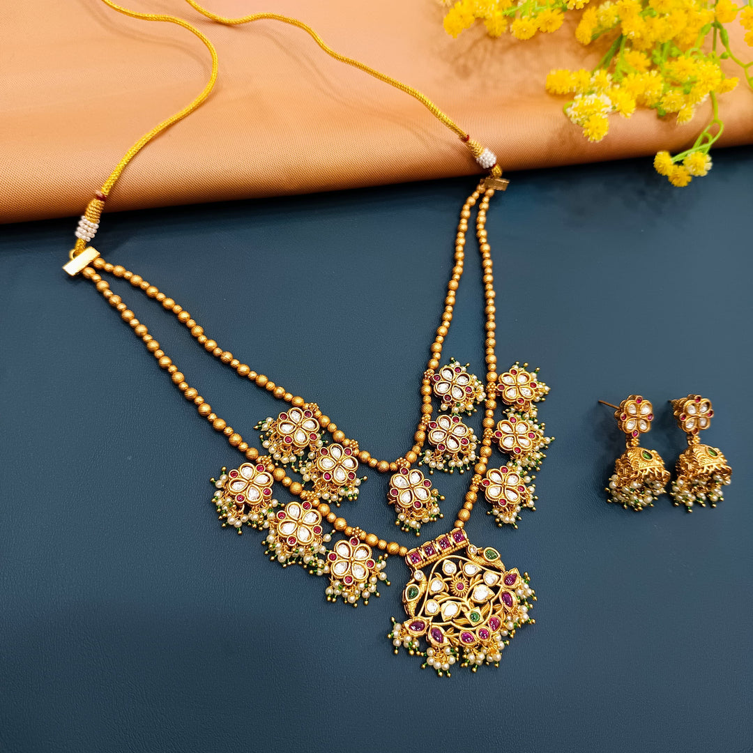 Antique gold choker necklace with Indian motifs, designed for weddings and formal events.