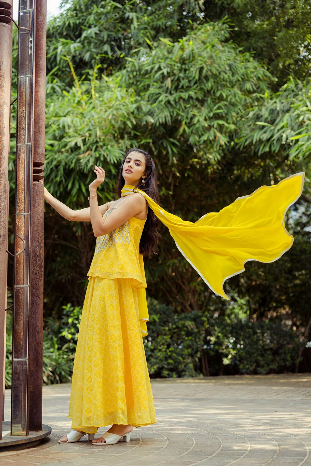 Stylish yellow georgette palazzo pants and matching top set for a chic casual look.