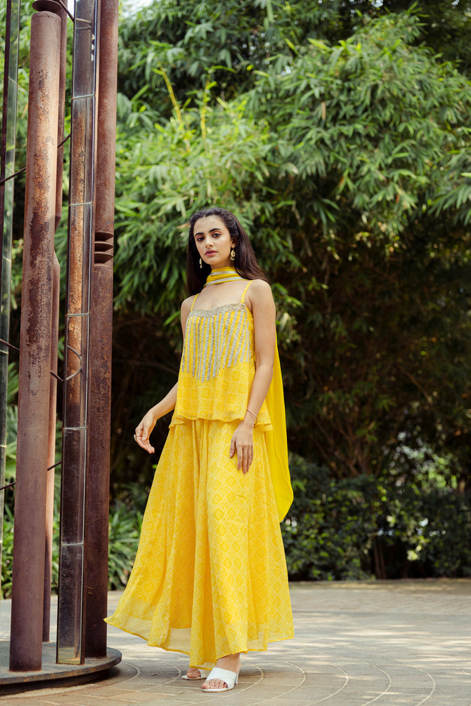 Beautiful yellow palazzo pants and top set made from lightweight georgette fabric, perfect for summer events.