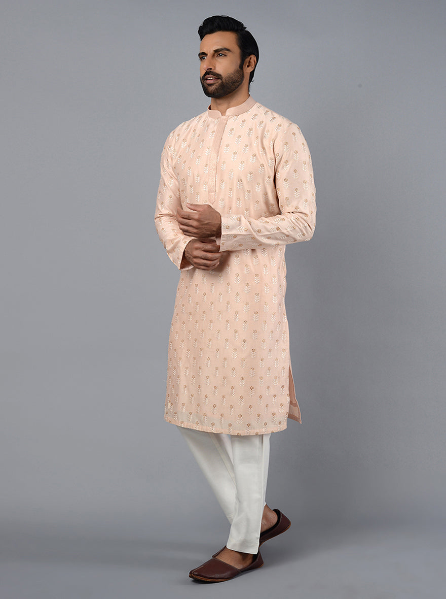 Make a lasting impression at your daughter's sangeet with this chic Peach Kurta Set.