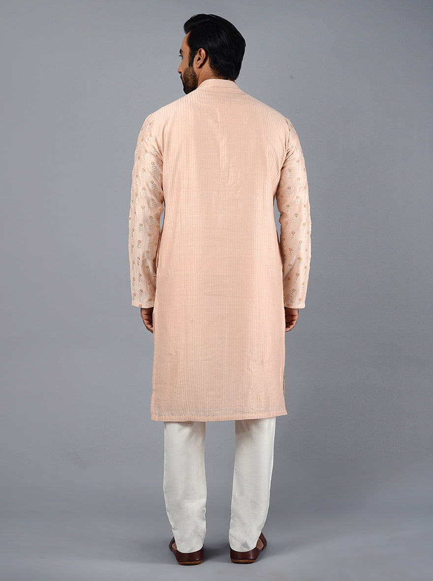 Discover the beauty of this elegantly designed Peach Kurta Set for special gatherings.