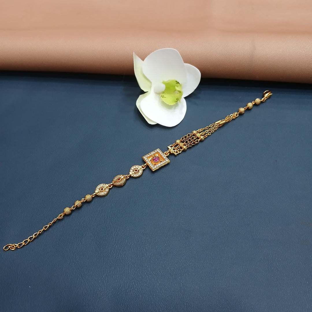 Charming golden bracelet with a small charm detail, great for gifting.