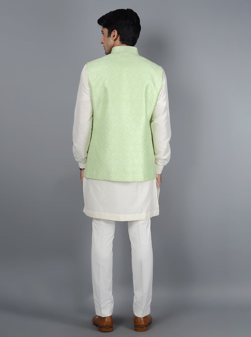 Celebrate tradition with a contemporary twist in this Pista Bandhgala jacket, featuring jacquard fabric, self-design, and a straight fit, ideal for weddings.