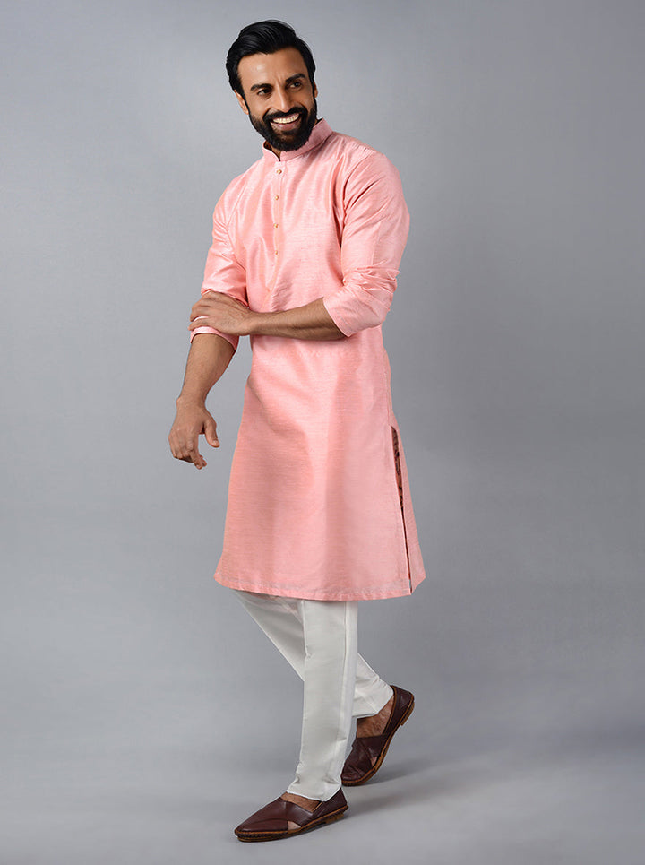 Celebrate in elegance with our beautifully crafted flamingo pink kurta set for special occasions.