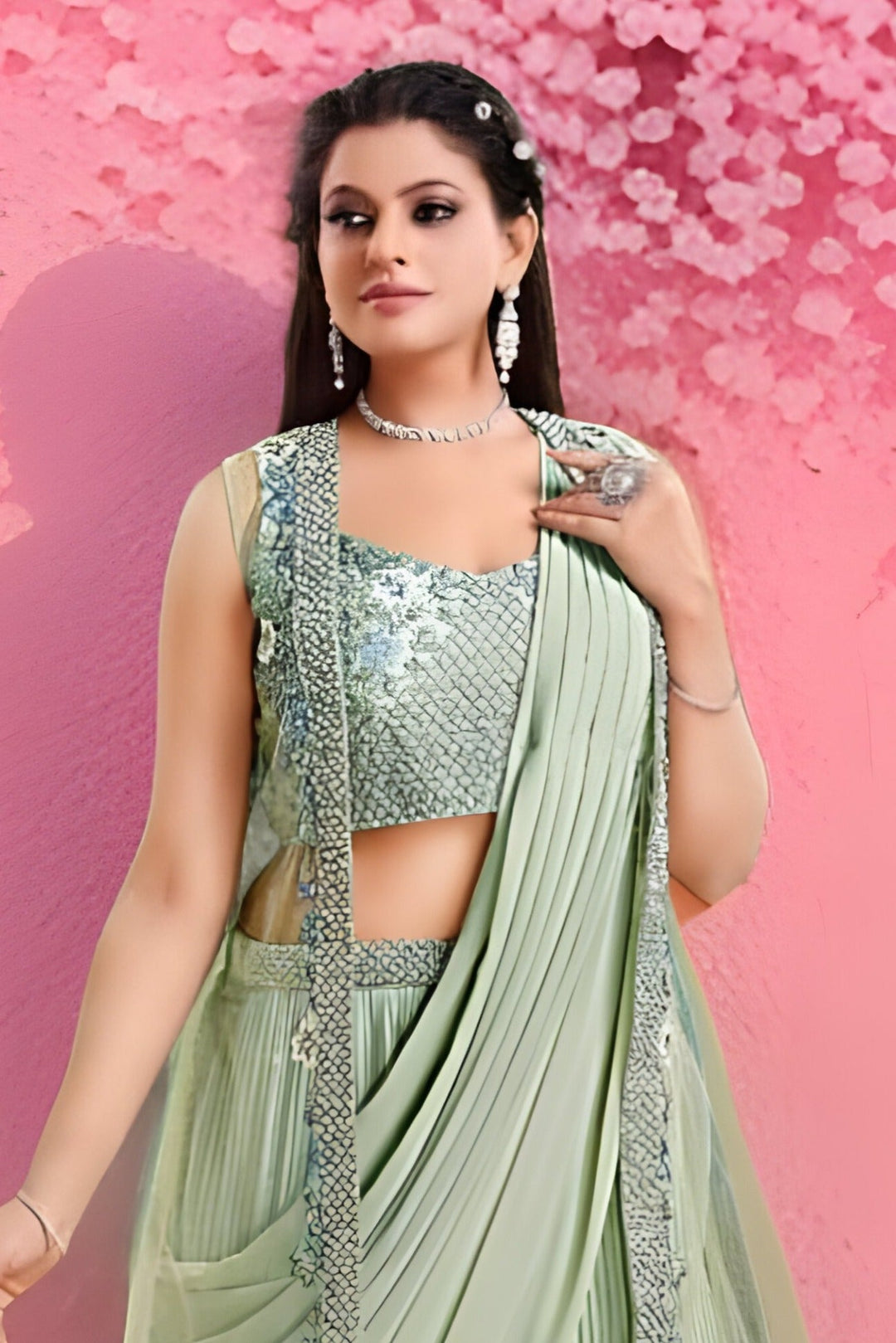 Elegant pista green wedding saree with an Indo-Western design, paired with a stylish blouse for festive celebrations.