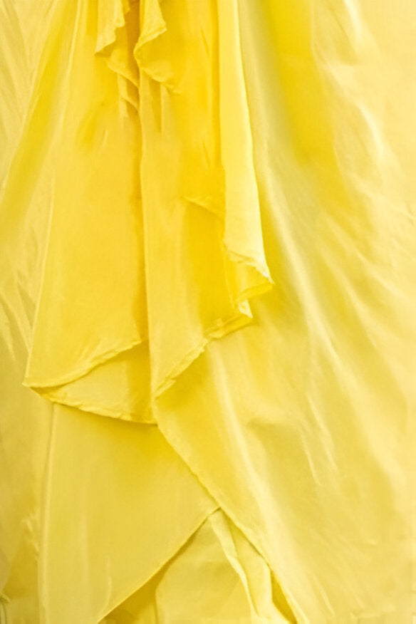 Beautiful yellow silk lehenga with a stylish crop top, perfect for creating a versatile and chic outfit.