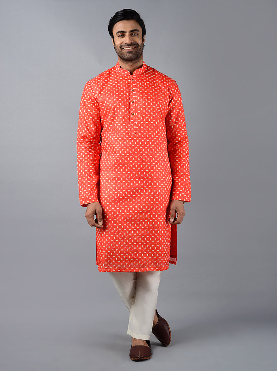 Perfect for bethak and poojas in the USA, this carrot red kurta set features premium silk blend fabric and full sleeves.