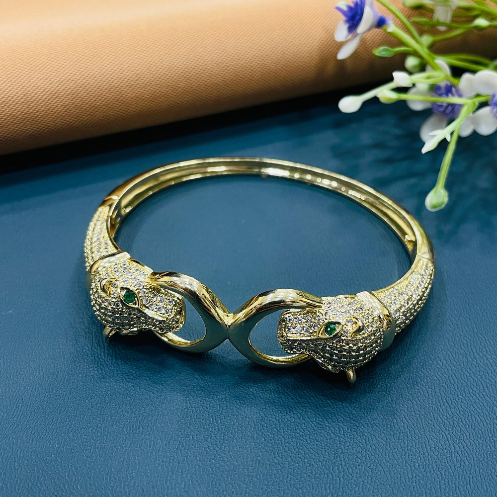 Sophisticated golden bracelet with a sleek, open design for versatile styling.