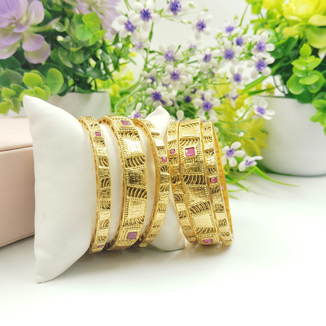 Trendy golden bangles that add a playful touch to any outfit.