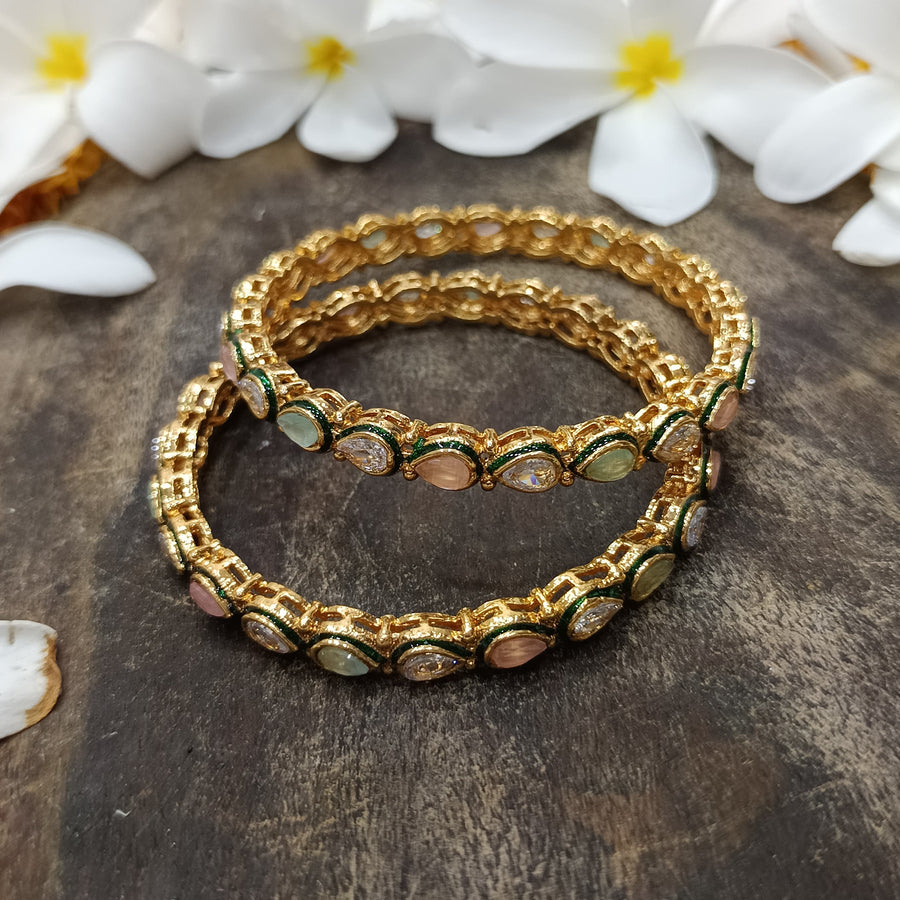 Unique golden bangles featuring artistic details for a distinctive style.