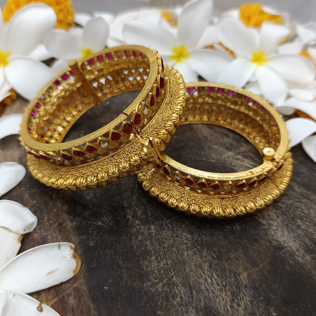 Trendy golden bangles that are perfect for layering and stacking.