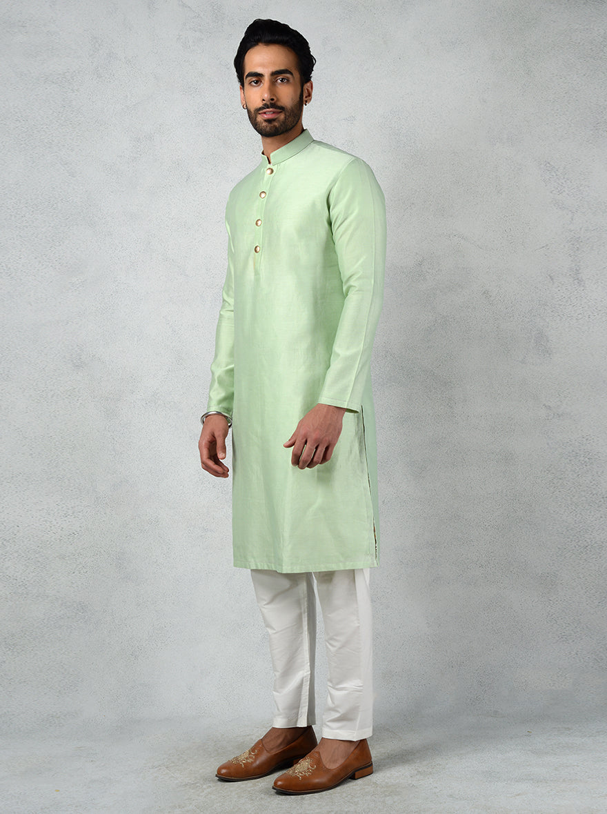 Make a statement at events with this stylish Pista Green Kurta Set designed for festive occasions.