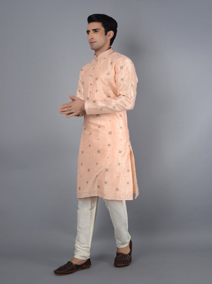 Perfect peach kurta set for celebrations and gatherings.