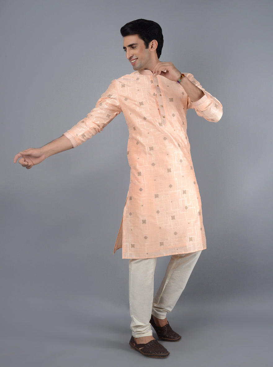 Comfortable peach kurta pajama for festive charm.