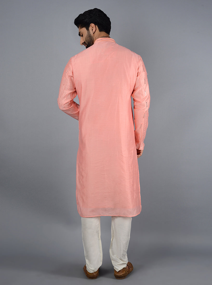 Stylish pink kurta set ideal for festive occasions.