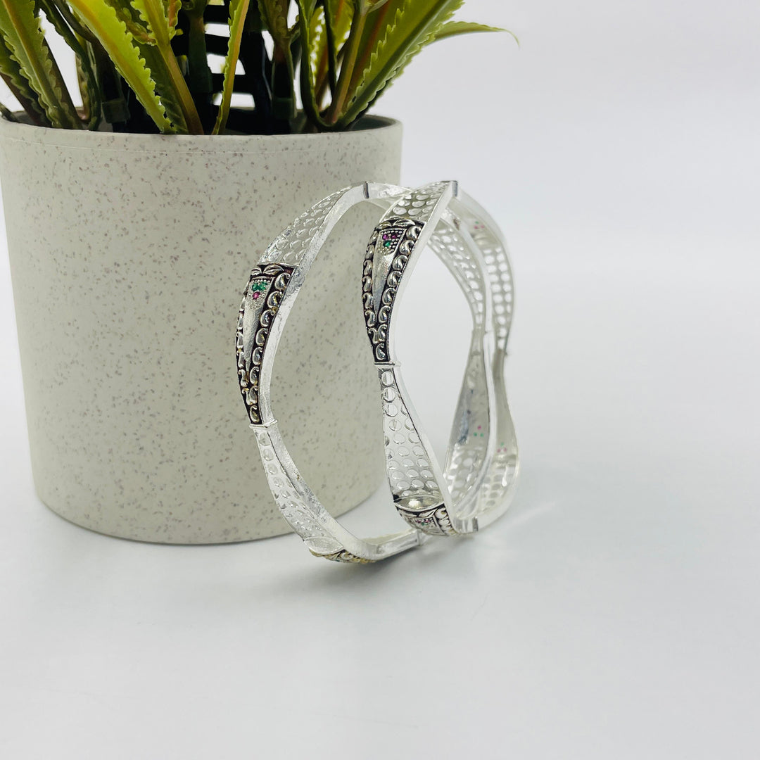 Timeless silver bangle designed for the modern woman, suitable for both casual and formal occasions.