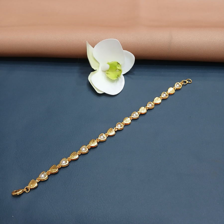 Artisan-crafted golden bracelet with intricate detailing, perfect for special moments.