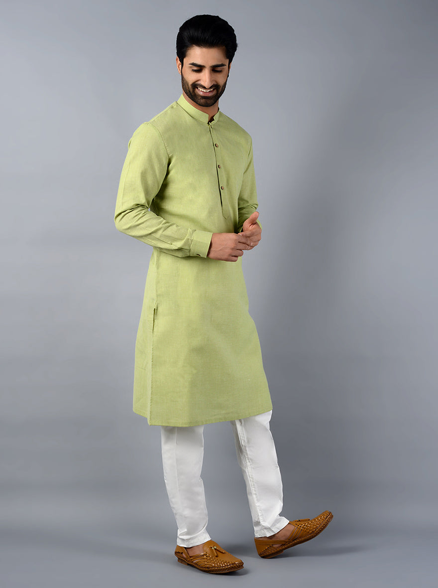 Make a statement at family functions with this comfortable leaf green kurta set.