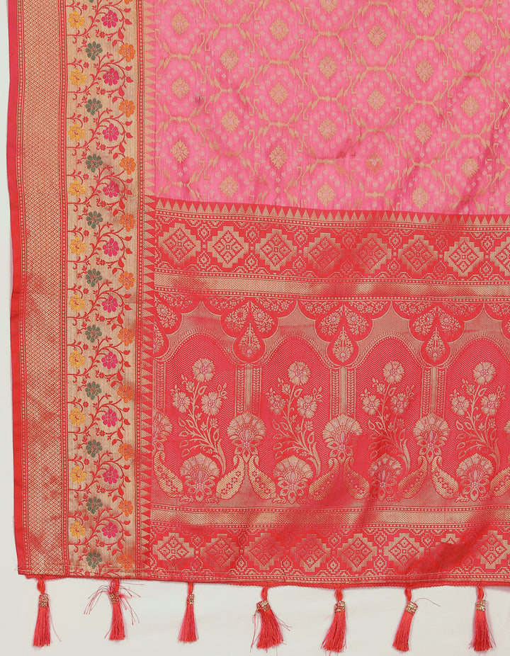 Traditional coral pink Meenakari organza silk saree with zari work and tassels, perfect for elegant occasions.