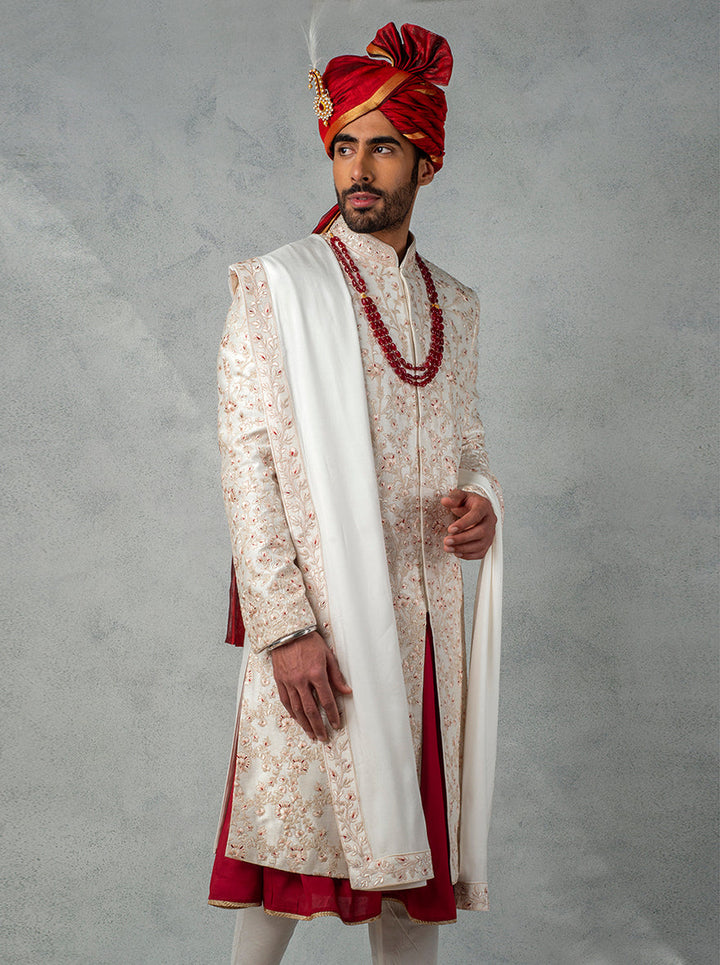 Make your wedding day unforgettable with this stunning off-white sherwani, designed for modern grooms.