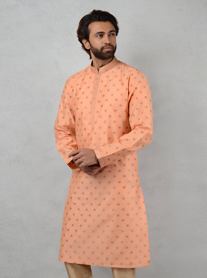 Experience sophistication in this Peach Silk Jacquard Butti Weave Kurta Set, designed for modern celebrations.