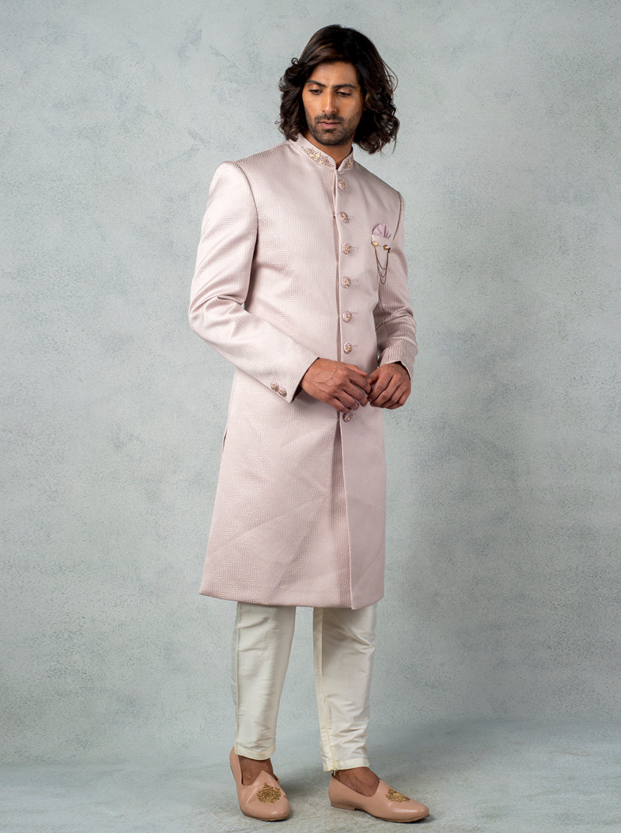 Onion Pink Indo Western outfit with hand embroidery, slim trousers, and matching pocket square.