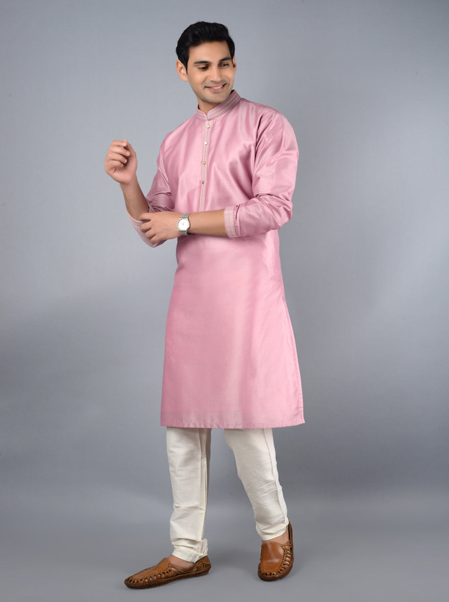 Elegant onion pink kurta pajama, crafted from high-quality fabric with intricate embroidery, ideal for special occasions.