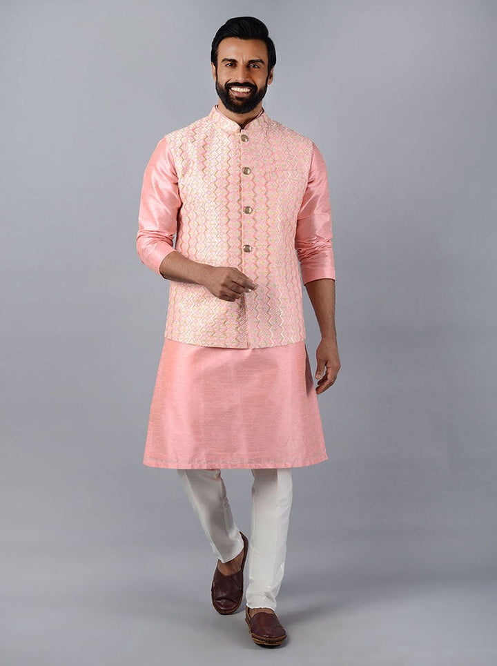 Luxurious blush pink Bandhgala jacket with intricate embroidery, ideal for festive celebrations.