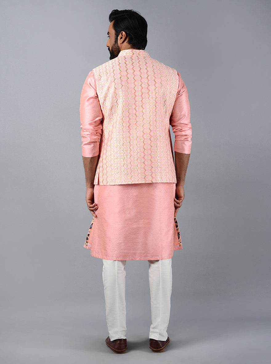 Captivating blush pink Bandhgala jacket combining elegance and comfort for festive occasions.