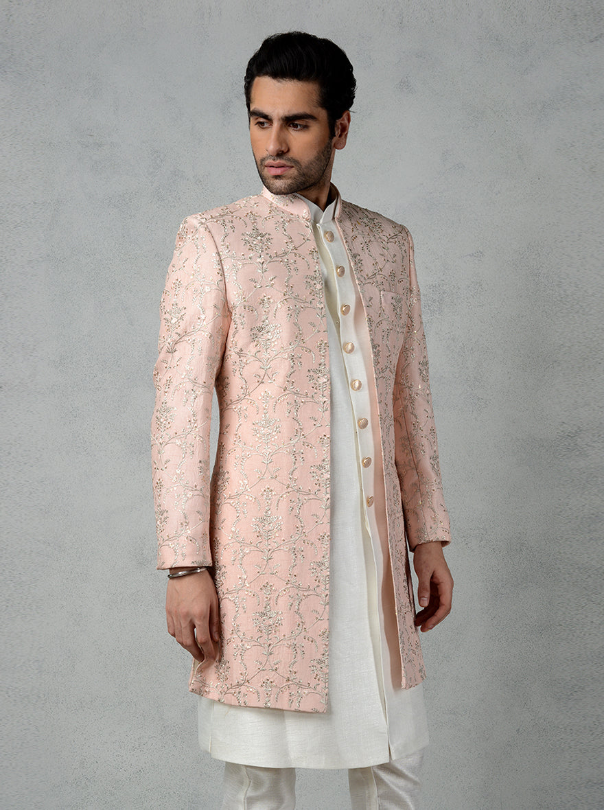 Men's peach Indo Western kurta with front open style, gold sequins, and metal buttons.