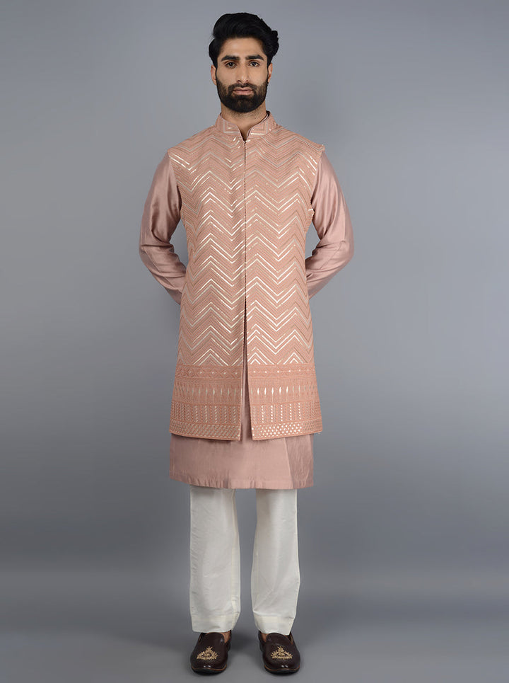 Stylish onion pink silk blend kurta set with elegant embroidery for festive events.