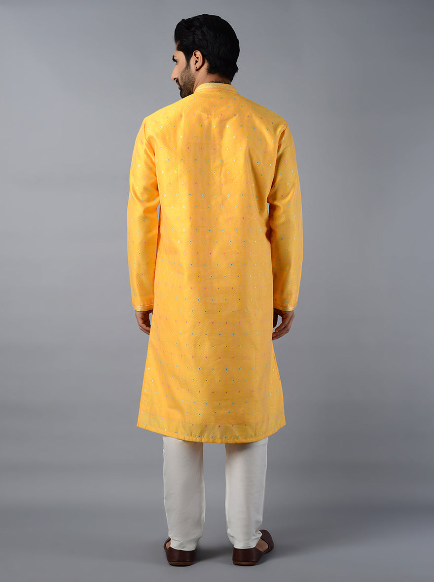 Experience comfort and style in this beautifully crafted yellow kurta set.