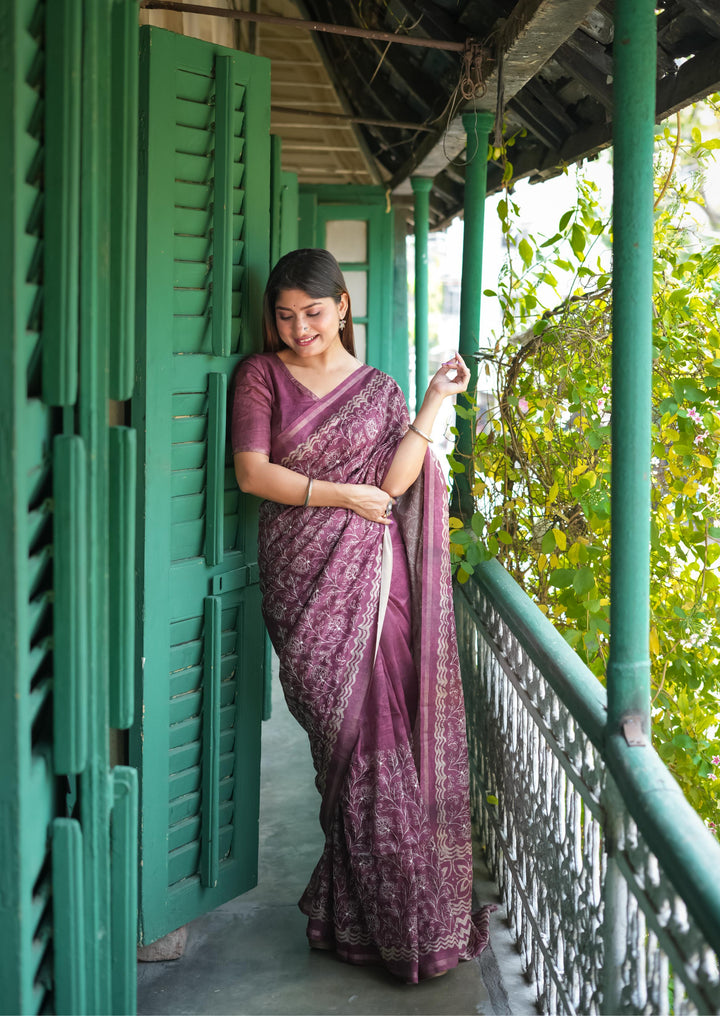 Elegant wine-colored Tussar silk saree with a batik border and fancy tassels, perfect for festive occasions.