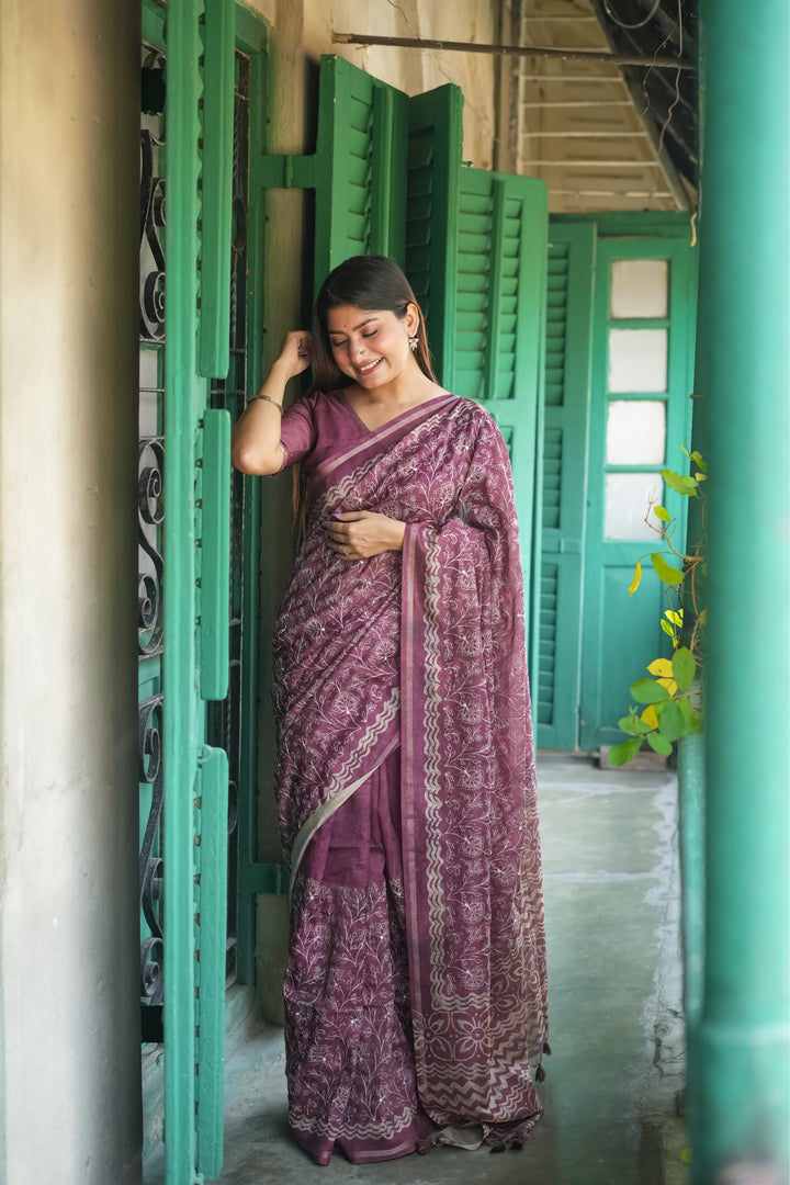 Beautiful wine Tussar silk saree with a stunning batik border and eye-catching tassels, perfect for festive wear.